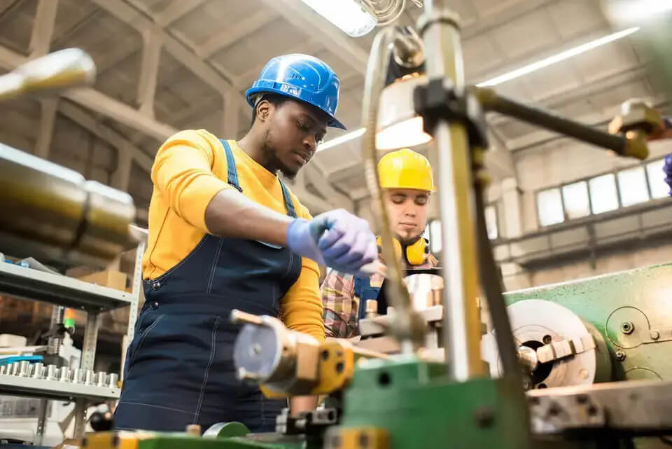 two men are working on technical fixes